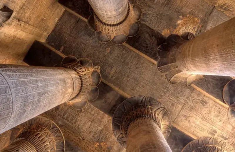 Esna Temple of Khnum — painted hypostyle hall sunk 9 metres below the modern town